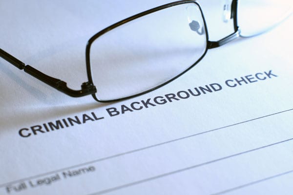 who is responsible for payment for background checks?
